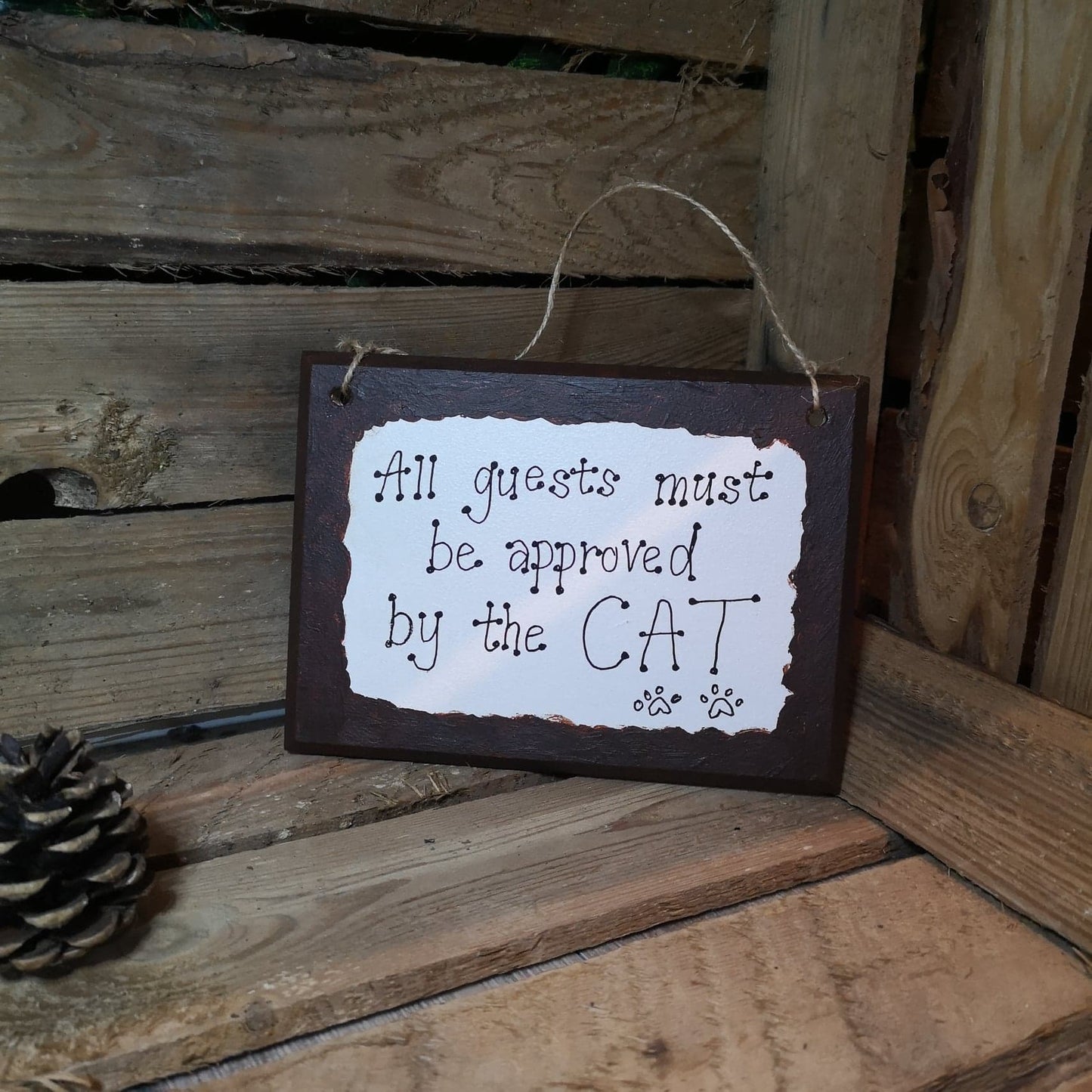 All Guests Must Be Approved by the Cat Sign from The Wrong End of Town