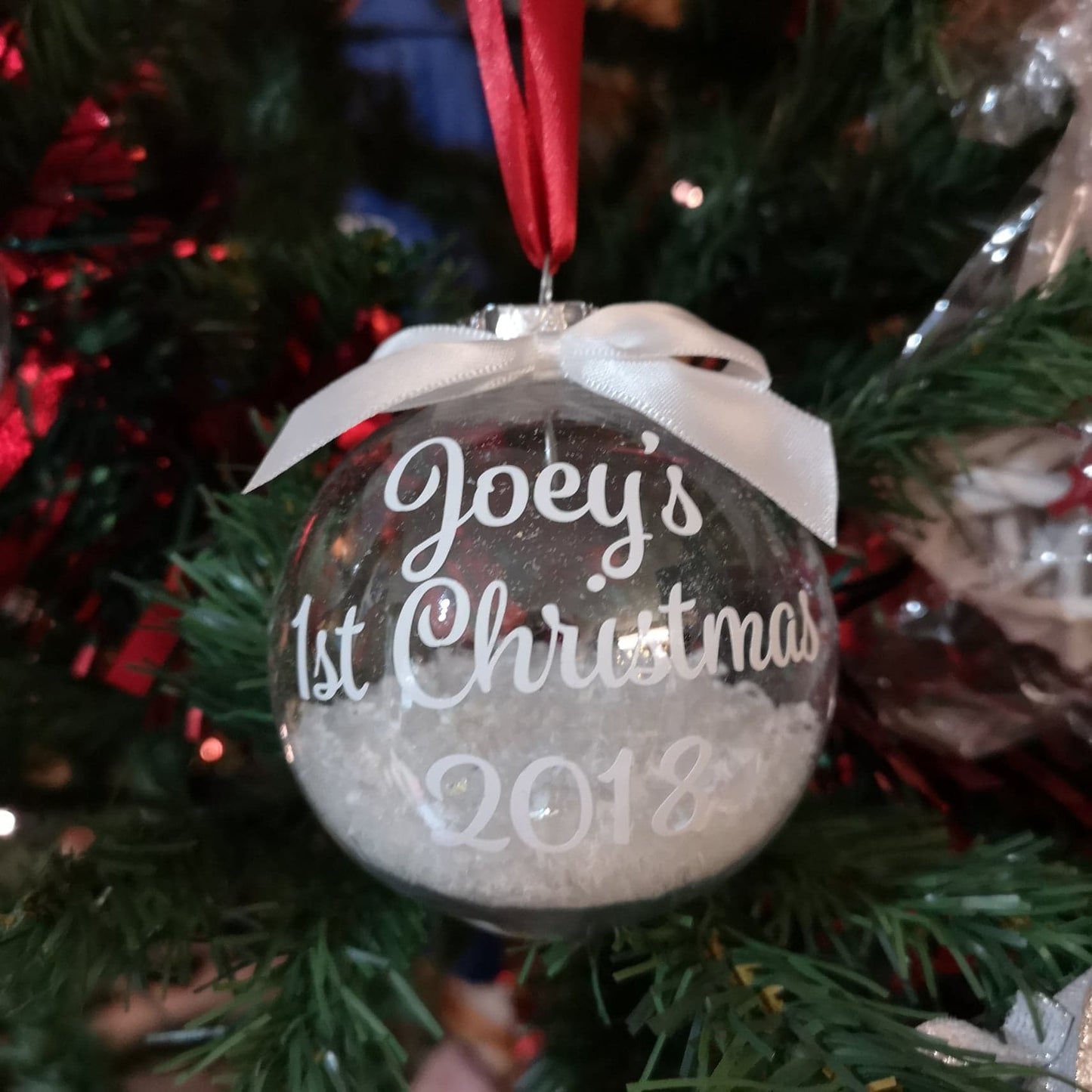 Personalised 1st Christmas Bauble with name, snowflakes and ribbon from The Wrong End of Town