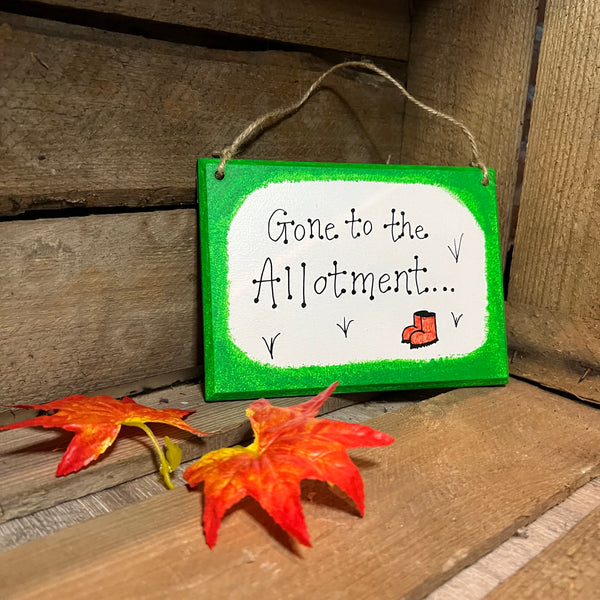 Wooden gone to the allotment sign